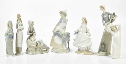 LLADRO; six figures including a water carrier, height 33cm, and a dancing girl, also two Nao figures