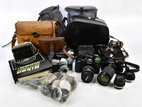 A collection of vintage cameras and accessories including Nikon F-801, etc.