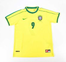 RONALDO NAZÁRIO; a 1998 retro style Brazil shirt, signed to the reverse, size L. Condition Report: