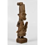 JOSEPH ADEYEMI FAKEYE (b.1931); an African carved wooden figure, signed to the underside, height