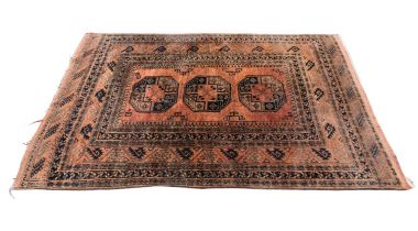 An Eastern style rug, of orange ground, with geometric decoration to the centre, 215 x 151cm.