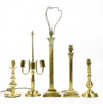 A group of five brass lamps, to include two Corinthian columns examples, height of largest 50cm.