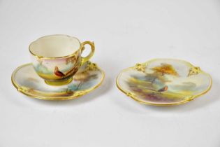 ROYAL WORCESTER; a Hadley period trio with hand painted decoration. Condition Report: Side plate