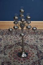 A modern silvered metal thirteen branch candle holder with glass inserts, height 93cm.