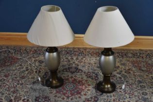 A pair of decorative silvered ceramic table lamps, height including fitting 67cm.
