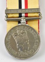 An Elizabeth II Iraq Medal, with 19th March - 28th April 2003 clasp, named to 25090305 Signalman