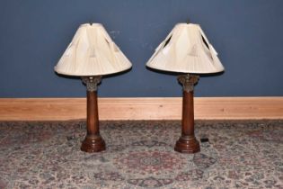 A pair of modern gilt metal on turned wood Corinthian column lamps, height including fittings 70cm.