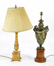 A modern decorative urn table lamp with mask handles, relief decorated with cherubs, height