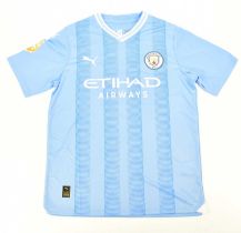 ERLING HAALAND; a signed Manchester City football shirt, signed to the reverse, size L. Condition