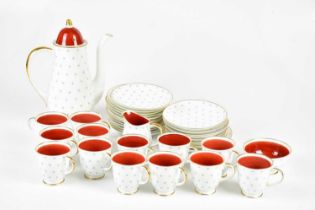 SUSIE COOPER; a twelve setting tea service. Condition Report: One of the saucers with a large crack.