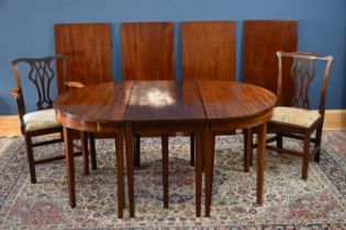 A Georgian mahogany D-end dining table with four leaves, height 73cm, width 160cm, depth 115cm,
