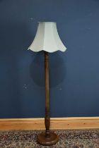 A beech standard lamp, height 154cm.
