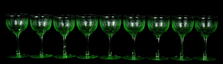 A set of nine Victorian etched uranium wine glasses.