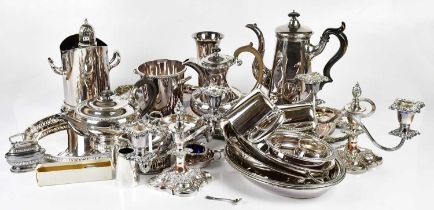 An assortment of silver plate, including a pair of twin branch candelabra, a tea service, assorted