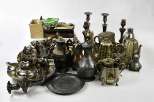 A large collection of silver plated items including teapots, coffee pots, claret jugs, cocktail