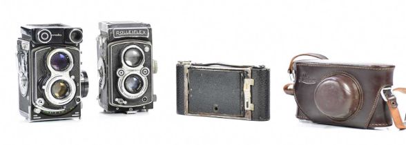 ROLLEIFLEX; a vintage camera, a Minolta twin lens camera and a Leica case, etc (4).