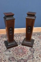 A pair of Edwardian mahogany and satinwood columns, each carved with a female mask, height 107cm (