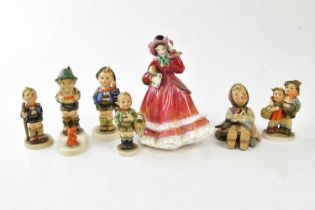 ROYAL DOULTON; a figure HN2110 'Christmas Time', and six Goebel figures (7).