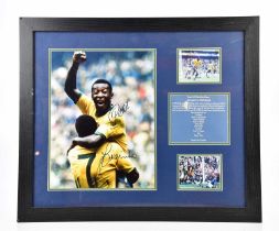 PELÉ; a photograph of Pelé celebrating with Jairzinho, signed by the pair, in montage, 50 x 60cm,