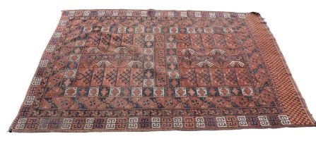 A red ground Eastern style rug with geometric pattern, 190 x 140cm.