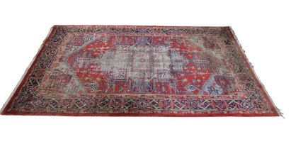 An Eastern style red ground with geometric pattern, 280 x 180cm.