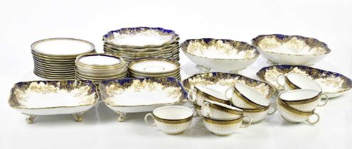 ROYAL DOULTON; a dessert service with a blue and raised gilt border, comprising ten plates, two oval