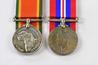 Two WWII medals with some associated paperwork, named to N77069 Private Wellington Ziwele