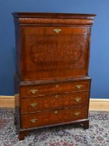 An early 19th century walnut and marquetry inlaid escritoire, with frieze drawer above fall front