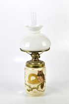 A ceramic vase shaped oil lamp featuring a gold owl, with a drop-in vessel, brass burner gallery and