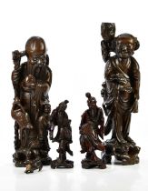 A large pair of Chinese rootwood figures, height 53cm, one example af, and a smaller pair of Chinese