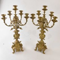 A pair of modern brass six branch candelabra in the rococo style, height 60cm (2).
