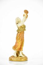 ROYAL WORCESTER; a blush ivory female figure with cymbals, height 28cm. Condition Report: Flea
