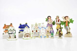 STAFFORDSHIRE; two money boxes, three Coalport pastille burners, a pair of Continental figures and