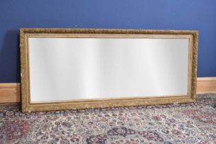 A large late 19th century gilt framed rectangular wall mirror, relief decorated with grapevine and