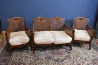 An early 20th century three piece Bergere suite.