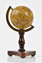 PETER FLETCHER; a 19th century miniature terrestrial globe on tripod base, height 9.5cm.