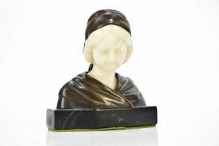 G MOERLIN; an Art Nouveau bronze and alabaster bust of a Dutch girl, on marble plinth base,