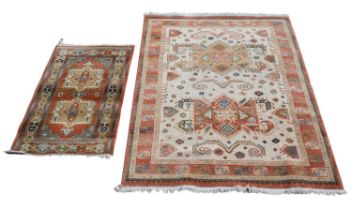 A Kabir rug, approx 170 x 235cm, and a similar smaller example, approx 145 x 85cm.