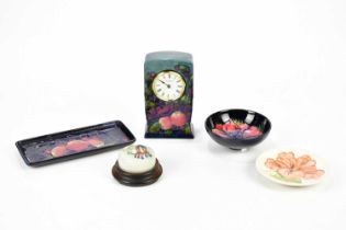 MOORCROFT; five pieces including a mantel clock in the 'Finches' pattern, pen tray in the same