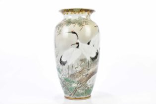 A Japanese Satsuma porcelain vase decorated with cranes in landscape, height 37cm.