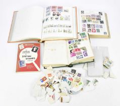 A large collection of stamps in albums and loose, including examples from Austria, Australia, etc.