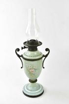 A Victorian painted opaque glass oil lamp, with metal scrolling handles and Wright & Butler duplex