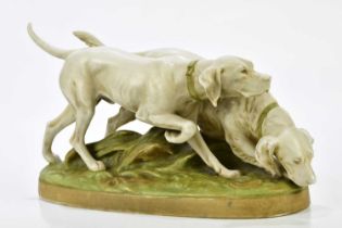 ROYAL DUX; a porcelain figure group of two hunting dogs, embossed pink triangle mark and numbered
