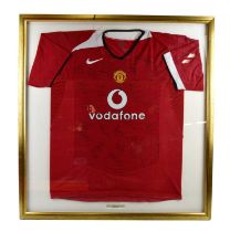 MANCHESTER UNITED; a 2004/05 home football shirt, bearing indistinct signatures, framed and glazed.