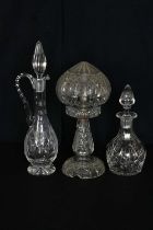 A cut glass mushroom lamp and shade, height 34cm, a cut glass claret jug and a cut glass decanter (