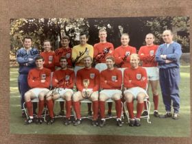 A contemporary print on canvas of the 1966 World Cup winning team, bearing various signatures, Nobby