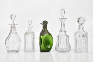 A group of four cut glass decanters, largest 32cm, together with a green glass and pewter Art