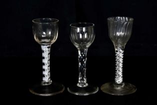 A 19th century wine glass with fluted bell shaped bowl and opaque stem on conical foot, height 14cm,