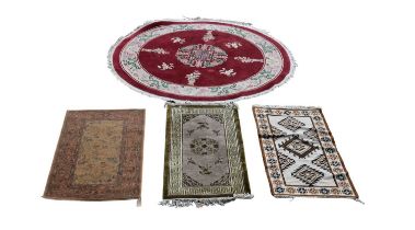 A group of four modern carpets to include a circular Chinese superwash example, diameter 187cm.