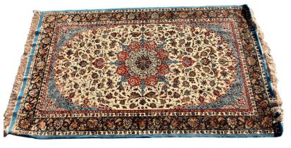 A Persian designed floral decorated rug with pale blue and cream ground, 240cm x 153cm. Condition